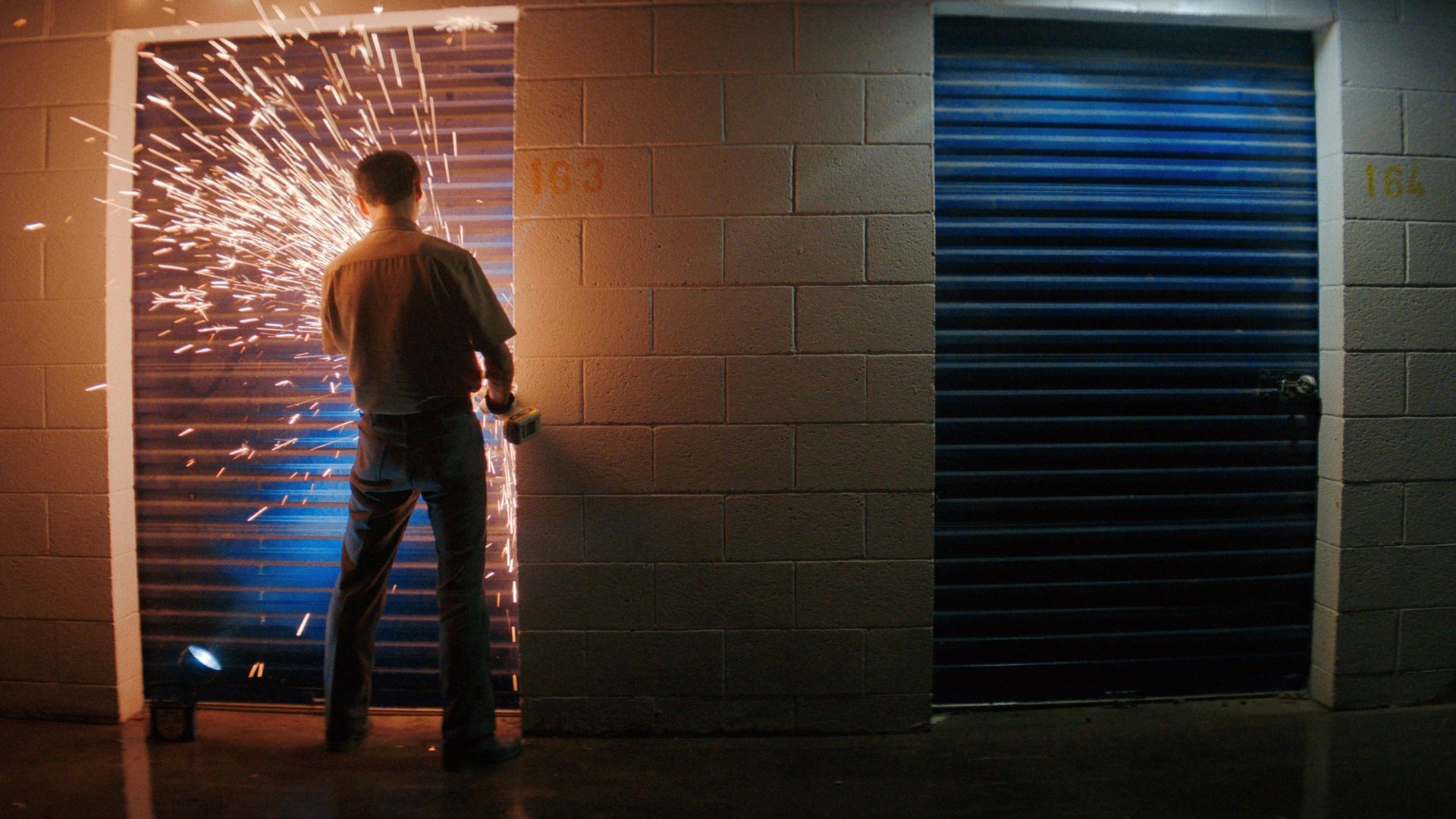 Sparks, a grinder and a locked storage unit.